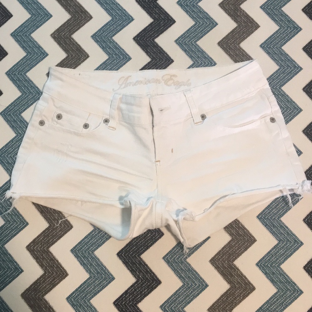 Distressed white shorts